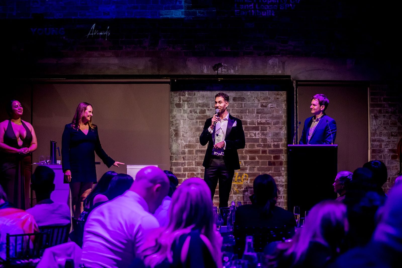 2025 Sydney Young Entrepreneur Awards Gala dinner Winners accepting trophies on stage at the 2025 Sydney Young Entrepreneur Awards